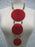 Triple Disc Necklace with Horn and Center Bead Metallic Red